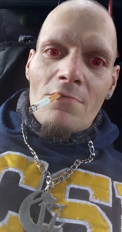 0N3R1 Tha Wicced 1 With Red Contacts Smokin a Cigarette Wearin A Chapter 17 Chain