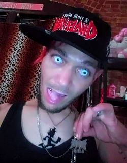 0N3R1 Tha Wicced 1  wearing a Ouija Macc Wasteland Hat & a Hatchetman Necklace and a Ouija Macc Necklace